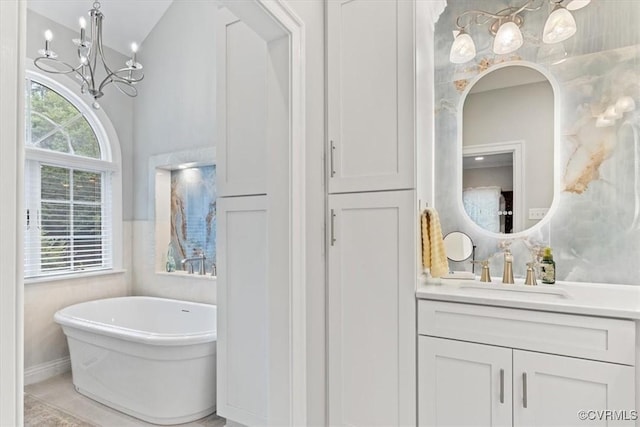 11216 Woodstock Heights Dr, Glen Allen, VA 23059 - bathroom featuring vanity, a freestanding tub, and a chandelier