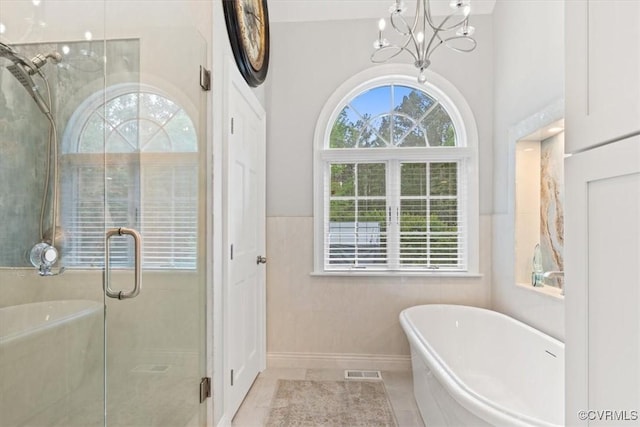 11216 Woodstock Heights Dr, Glen Allen, VA 23059 - full bath featuring a freestanding bath, a chandelier, and a stall shower