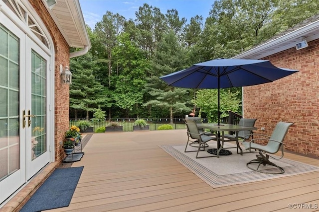 11216 Woodstock Heights Dr, Glen Allen, VA 23059 - wooden terrace featuring french doors, outdoor dining area, and view of scattered trees