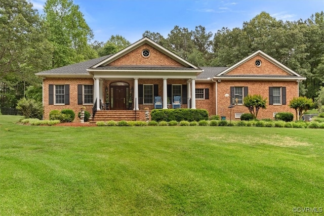 11216 Woodstock Heights Dr, Glen Allen, VA 23059 - greek revival house with brick siding, a front lawn, and a porch