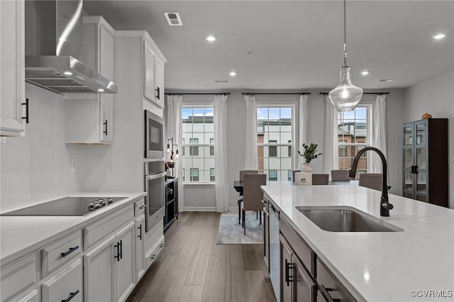 13285 Coalfield Station Ln, Midlothian, VA 23114 - kitchen featuring wall chimney exhaust hood, appliances with stainless steel finishes, a sink, light countertops, and recessed lighting