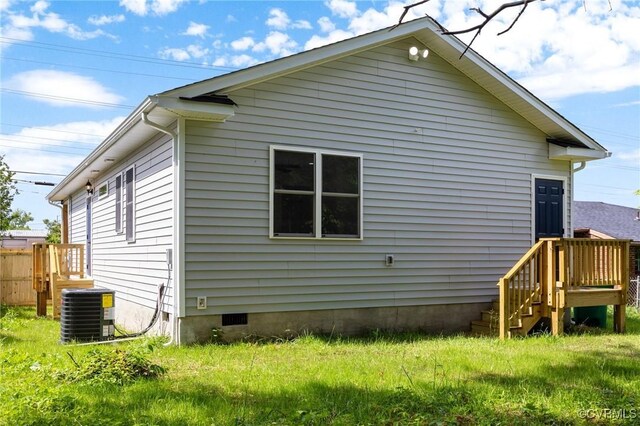 back of house featuring central AC