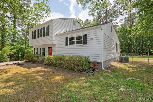 view of front of house featuring crawl space and central AC unit