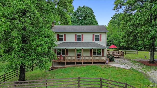 1112 Scotts Bottom Rd, Dillwyn, VA 23936 - view of front of house featuring a front lawn, a chimney, and a wooden deck