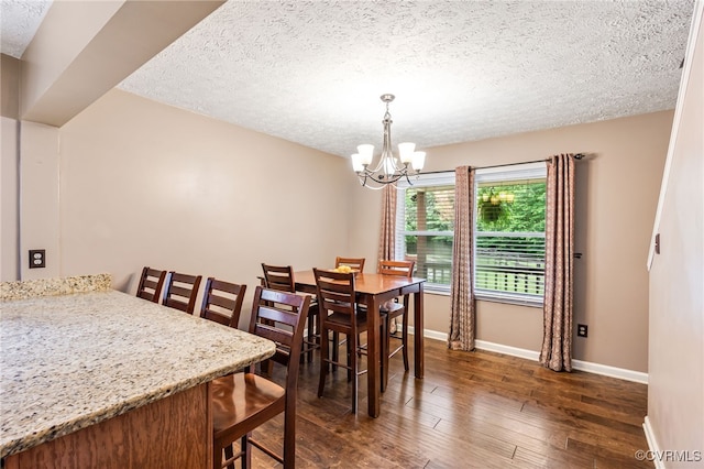 1112 Scotts Bottom Rd, Dillwyn, VA 23936 - dining space featuring a chandelier, dark wood-type flooring, and a textured ceiling
