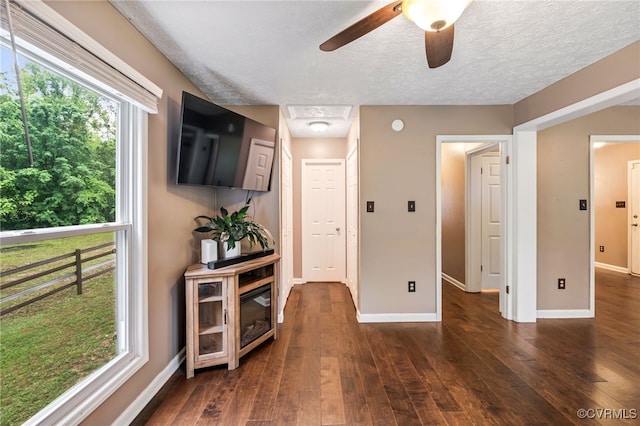 1112 Scotts Bottom Rd, Dillwyn, VA 23936 - unfurnished living room featuring dark wood-type flooring, a textured ceiling, and a ceiling fan