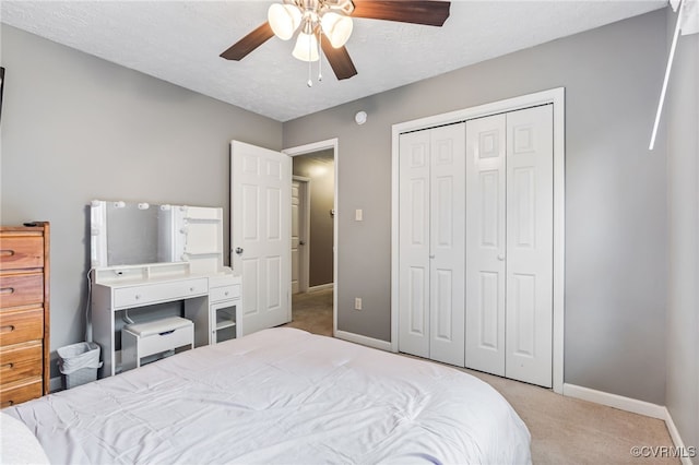 1112 Scotts Bottom Rd, Dillwyn, VA 23936 - bedroom with light carpet, a closet, ceiling fan, and a textured ceiling