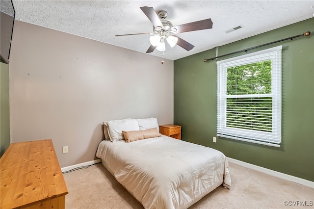 1112 Scotts Bottom Rd, Dillwyn, VA 23936 - bedroom with light colored carpet, a ceiling fan, and a textured ceiling