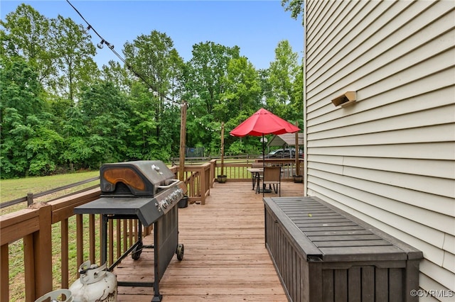 1112 Scotts Bottom Rd, Dillwyn, VA 23936 - wooden deck with outdoor dining area, view of wooded area, and grilling area