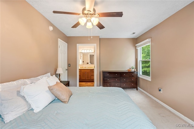 1112 Scotts Bottom Rd, Dillwyn, VA 23936 - bedroom with light colored carpet, connected bathroom, and ceiling fan