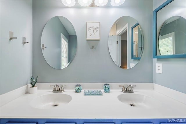 bathroom featuring double vanity