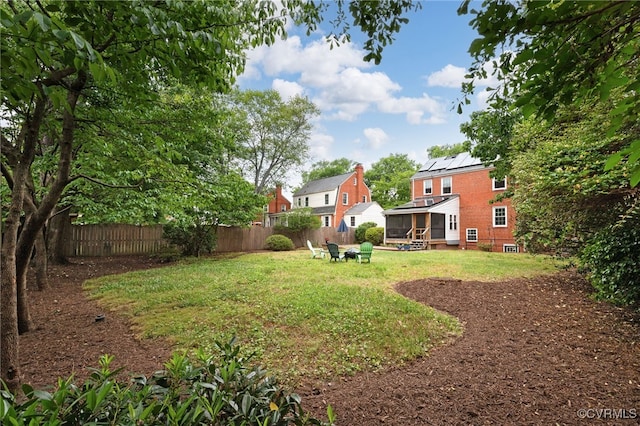 view of yard featuring a sunroom