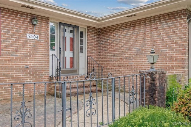 3304 N Marion Ave, Hopewell, VA 23860 - doorway to property with brick siding and fence