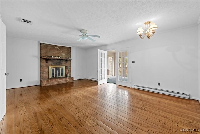 3304 N Marion Ave, Hopewell, VA 23860 - unfurnished living room with baseboard heating, a ceiling fan, wood-type flooring, a chandelier, and a textured ceiling