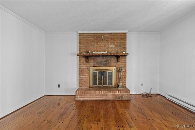 3304 N Marion Ave, Hopewell, VA 23860 - unfurnished living room featuring baseboard heating, wood-type flooring, a fireplace, ornamental molding, and baseboards
