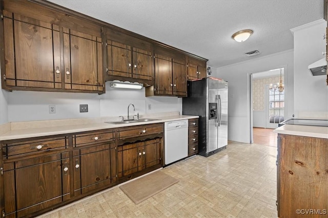 3304 N Marion Ave, Hopewell, VA 23860 - kitchen featuring dishwasher, a sink, stainless steel refrigerator with ice dispenser, a chandelier, and light countertops