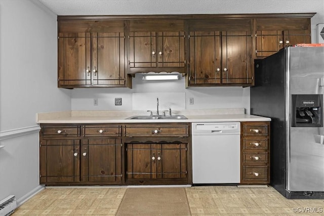 3304 N Marion Ave, Hopewell, VA 23860 - kitchen featuring white dishwasher, a sink, stainless steel fridge, a baseboard heating unit, and light countertops