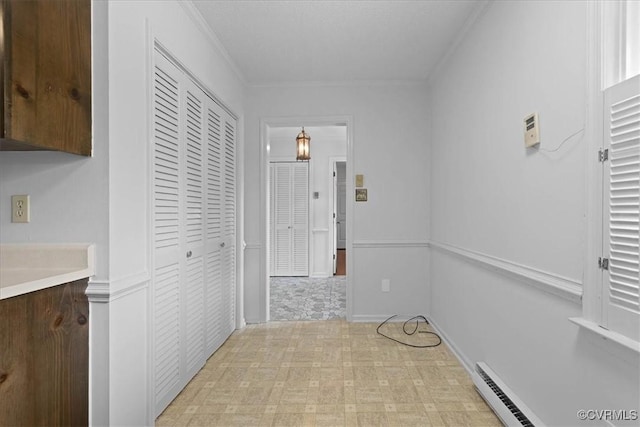 3304 N Marion Ave, Hopewell, VA 23860 - hallway featuring light flooring, a baseboard heating unit, and crown molding