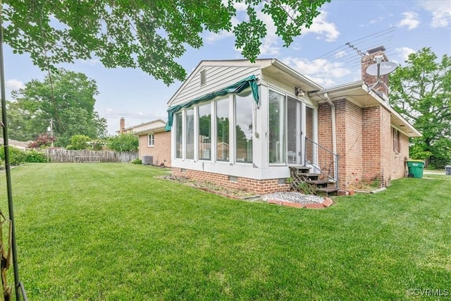 3304 N Marion Ave, Hopewell, VA 23860 - rear view of property with a sunroom, crawl space, a chimney, and central AC unit