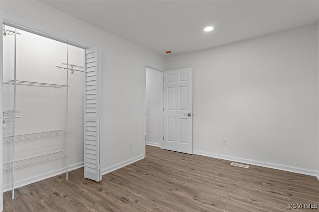 1505 Enon Church Rd, Chester, VA 23836 - unfurnished bedroom featuring wood finished floors, baseboards, recessed lighting, and a closet