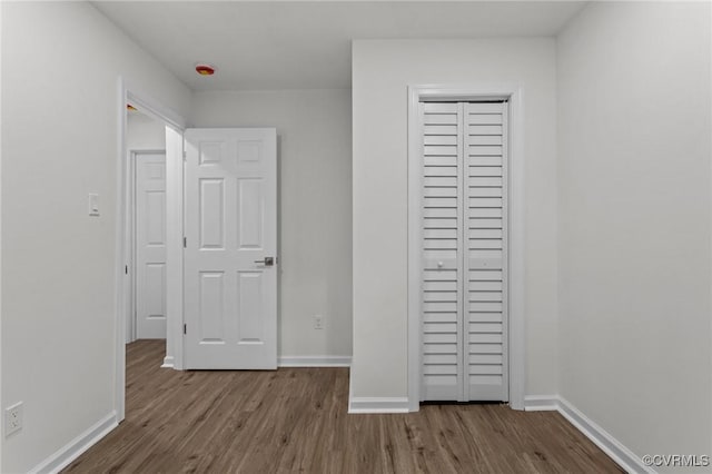 1505 Enon Church Rd, Chester, VA 23836 - unfurnished bedroom with wood finished floors, baseboards, and a closet