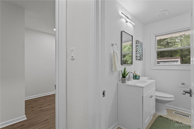 1505 Enon Church Rd, Chester, VA 23836 - bathroom with toilet, vanity, baseboards, and wood finished floors