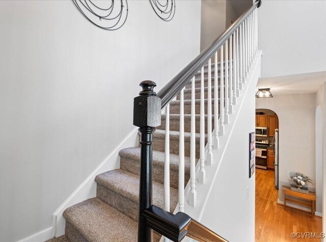 2013 Rose Family Dr, Midlothian, VA 23112 - stairway with arched walkways and wood finished floors