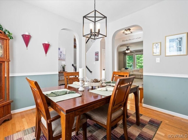 2013 Rose Family Dr, Midlothian, VA 23112 - dining area with arched walkways, light wood-style floors, a ceiling fan, and a chandelier