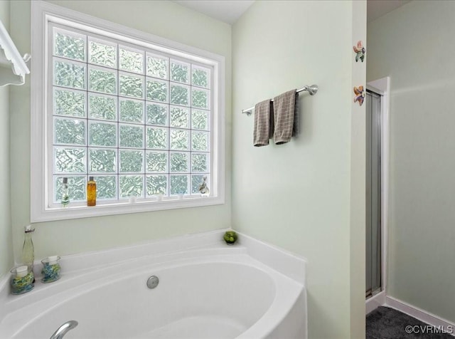 2013 Rose Family Dr, Midlothian, VA 23112 - bathroom with a bath and a stall shower