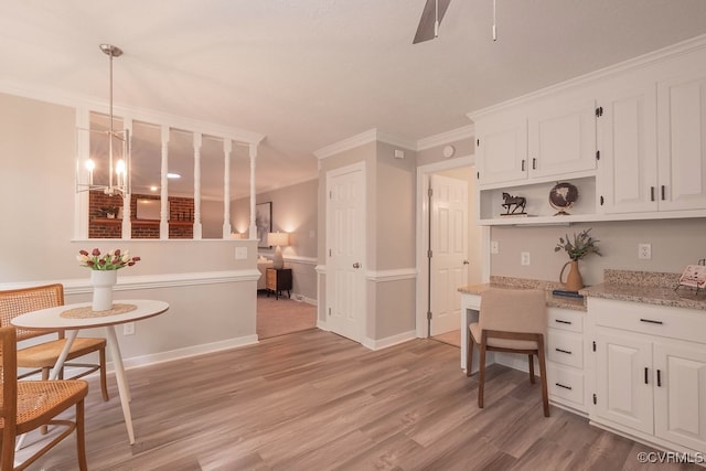 8282 Briarthorn Ct, Mechanicsville, VA 23116 - kitchen with crown molding, white cabinets, open shelves, light wood finished floors, and wainscoting