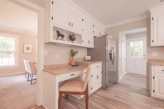 8282 Briarthorn Ct, Mechanicsville, VA 23116 - kitchen with stainless steel fridge with ice dispenser, white cabinets, ornamental molding, open shelves, and light wood finished floors