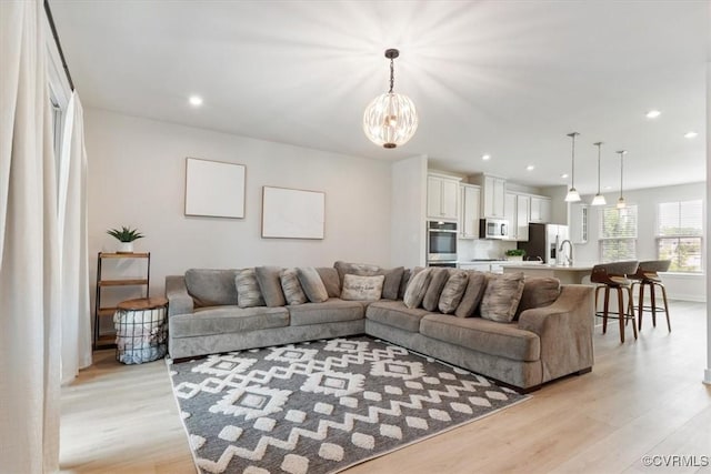 1906 Chartermark Dr, Midlothian, VA 23114 - living area featuring light wood-style flooring, a chandelier, and recessed lighting