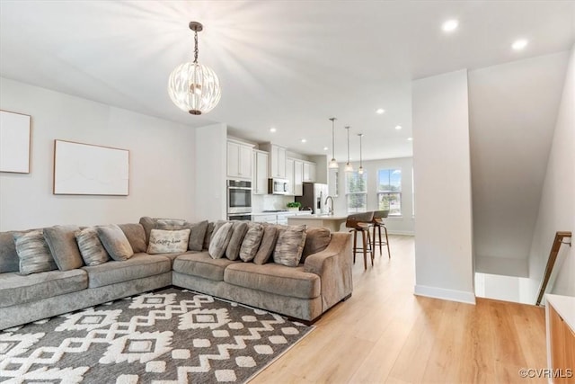 1906 Chartermark Dr, Midlothian, VA 23114 - living room featuring a chandelier, light wood-style flooring, recessed lighting, and baseboards