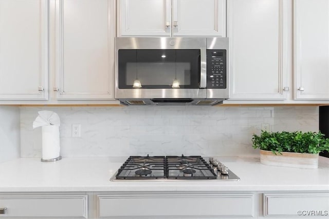 1906 Chartermark Dr, Midlothian, VA 23114 - kitchen with appliances with stainless steel finishes, light countertops, decorative backsplash, and white cabinets