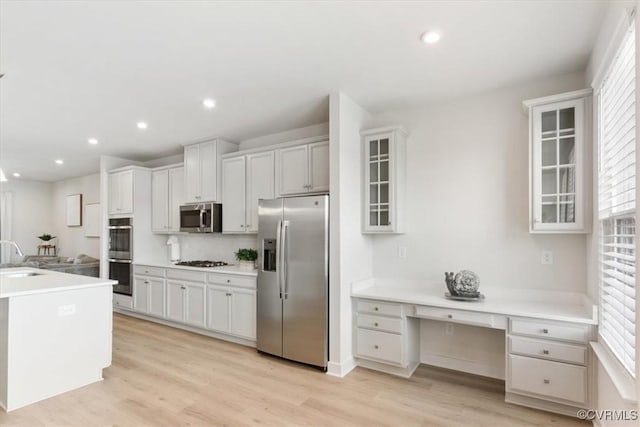 1906 Chartermark Dr, Midlothian, VA 23114 - kitchen featuring stainless steel appliances, a sink, light wood-style floors, glass insert cabinets, and recessed lighting
