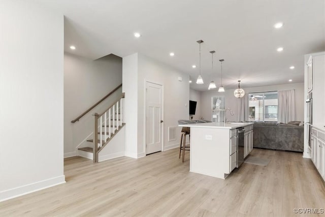 1906 Chartermark Dr, Midlothian, VA 23114 - kitchen featuring a sink, open floor plan, appliances with stainless steel finishes, a kitchen island with sink, and light wood-style floors
