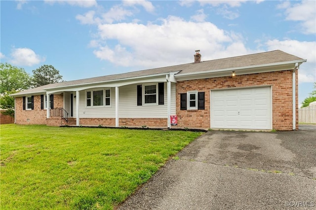 single story home with a garage, a front yard, brick siding, driveway, and a chimney