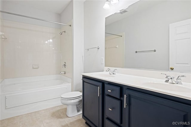 full bath featuring tile patterned floors, toilet, tub / shower combination, and double vanity