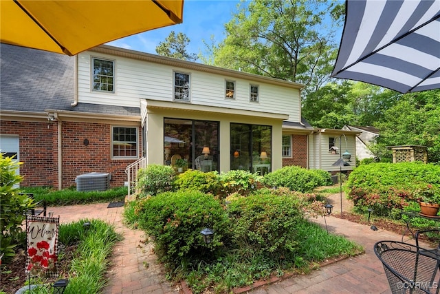 7290 Hill View Dr, Mechanicsville, VA 23111 - rear view of property featuring brick siding, central AC unit, and a patio