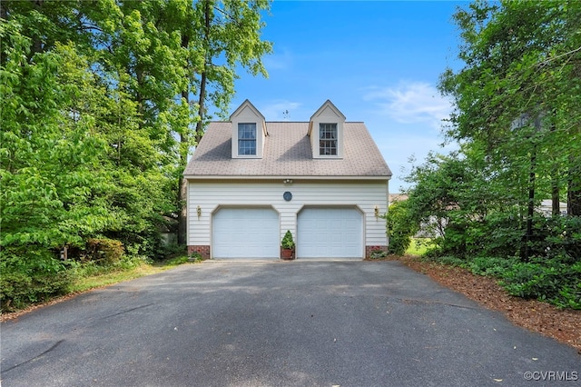 7290 Hill View Dr, Mechanicsville, VA 23111 - view of property exterior featuring a detached garage and roof with shingles