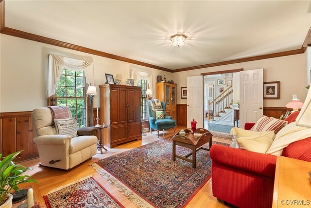 7290 Hill View Dr, Mechanicsville, VA 23111 - living area featuring a wainscoted wall, light wood finished floors, crown molding, and stairway