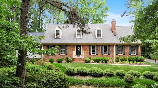 7290 Hill View Dr, Mechanicsville, VA 23111 - cape cod home featuring brick siding, a front yard, and a chimney