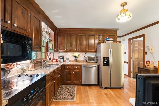 7290 Hill View Dr, Mechanicsville, VA 23111 - kitchen featuring appliances with stainless steel finishes, a sink, ornamental molding, light stone countertops, and light wood finished floors