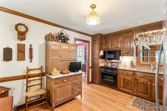 7290 Hill View Dr, Mechanicsville, VA 23111 - kitchen with black appliances, light countertops, light wood-style flooring, a sink, and brown cabinetry