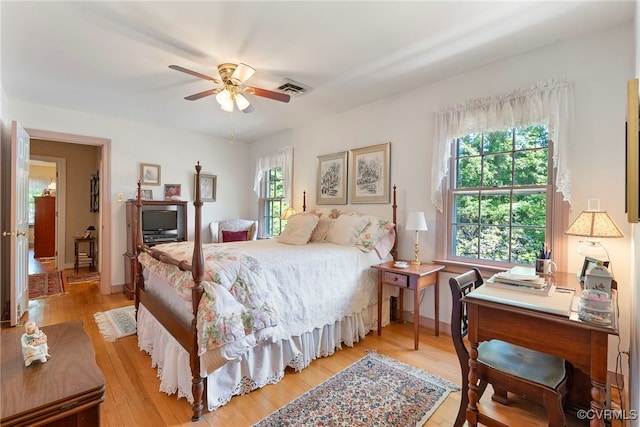 7290 Hill View Dr, Mechanicsville, VA 23111 - bedroom featuring multiple windows, light wood-style flooring, a desk, and baseboards