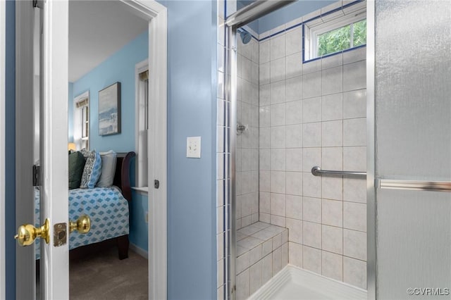 bathroom featuring ensuite bathroom and a shower stall
