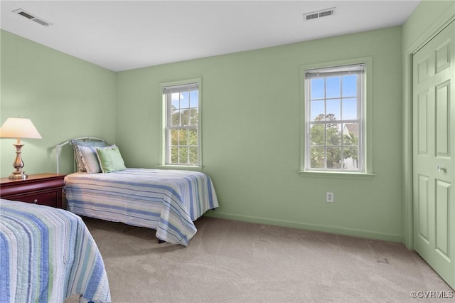 bedroom with carpet flooring and baseboards