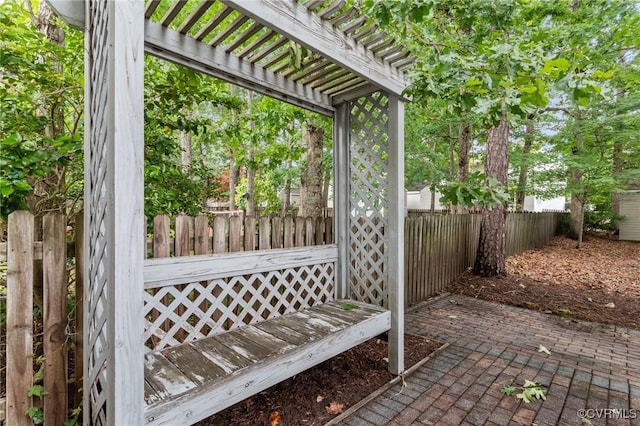 view of patio / terrace with a fenced backyard and a pergola