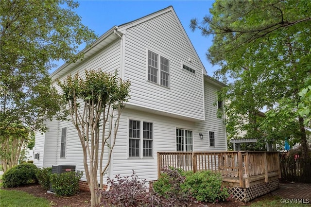 rear view of house featuring a deck