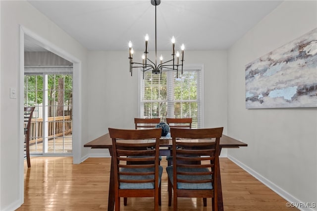 11441 Alder Glen Way, Glen Allen, VA 23059 - dining space with light wood-style flooring, a chandelier, and baseboards